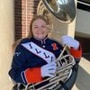 Image of Marie Jensen in Illini Marching Band uniform with large tuba